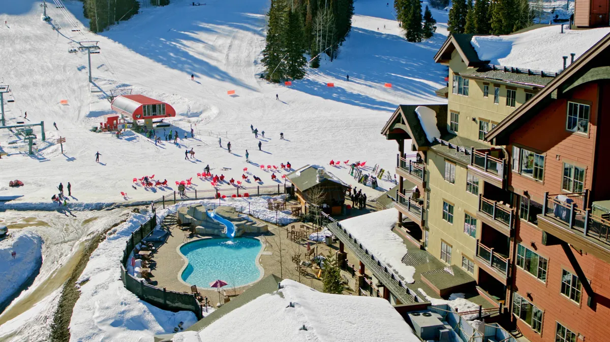A vibrant exterior with ski slopes, a swimming pool, a ski lift, and a lodge building, bustling with winter sports and après-ski relaxation. The scene suggests a joyful, all-seasons destination.